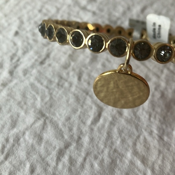 Gold tone slip on faux gem bracelet with gold charm - Picture 3 of 16